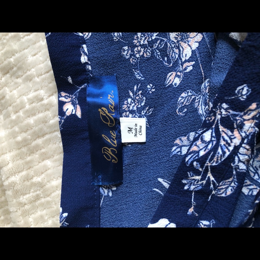 Wrap-midi skirt. Size M. Navy with white and pink floral pattern.